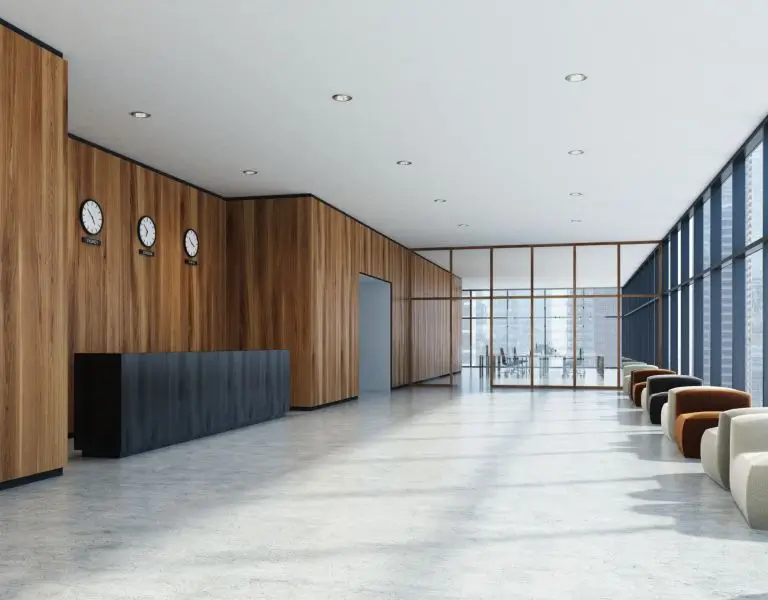a reception desk in a room with a glass wall