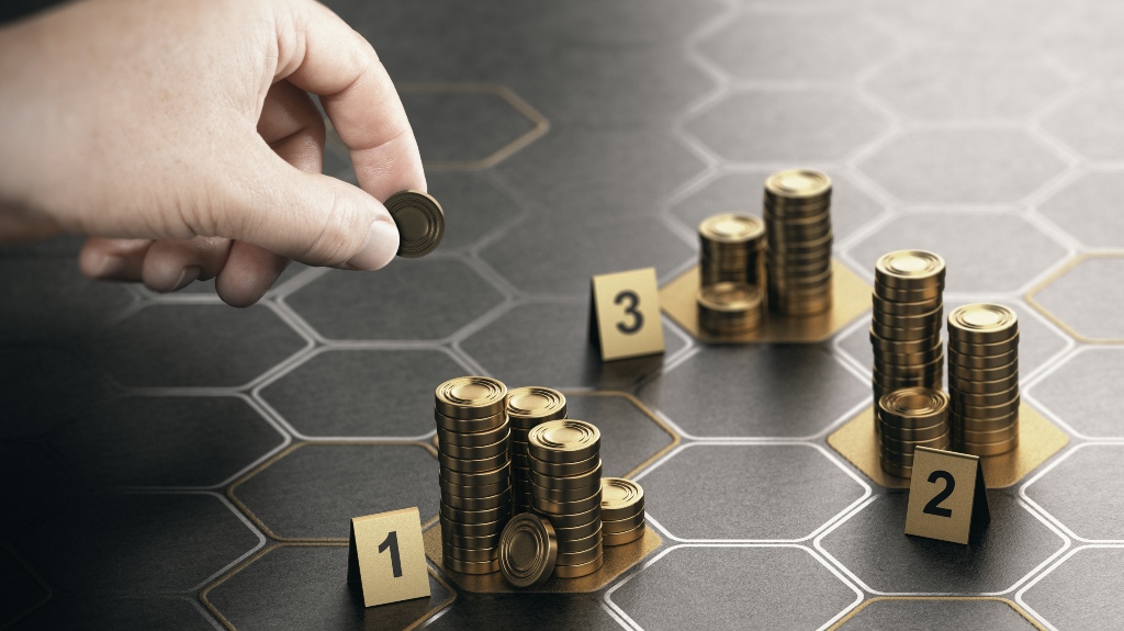 Human hand stacking coins on black background with hexagonal golden shapes