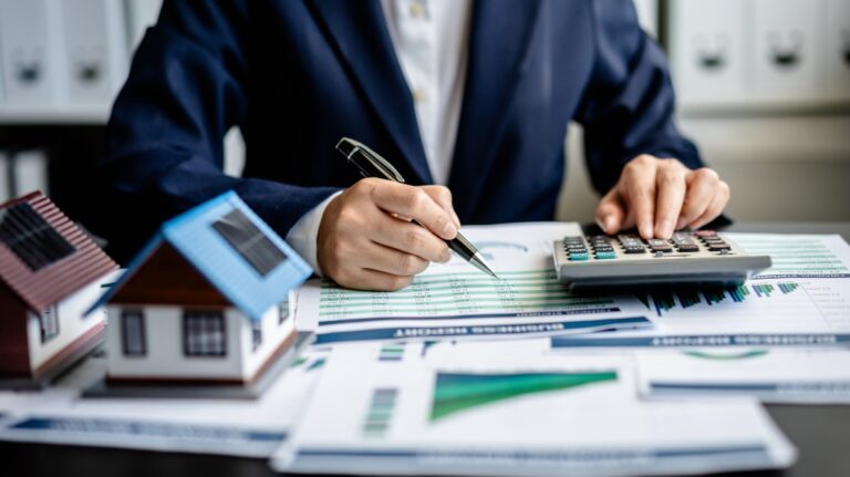 lawyer makes calculations of property taxes and eminent domain compensation