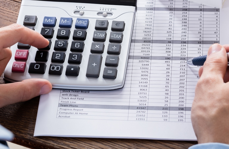 man calculates taxes