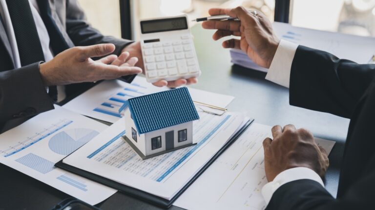 House model with agent and customer discussing