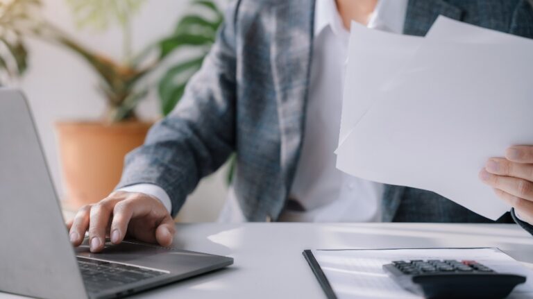 Businessman working at office with laptop