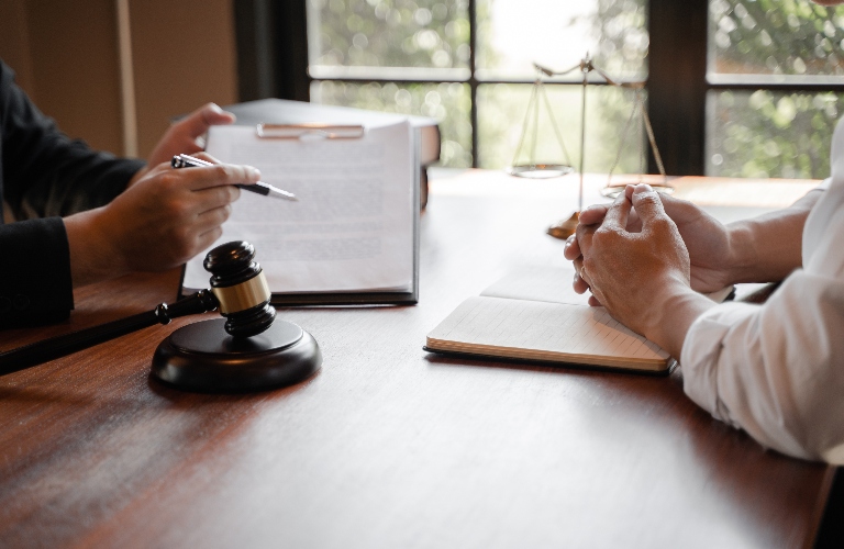 Lawyer consulting and reviewing documents with client